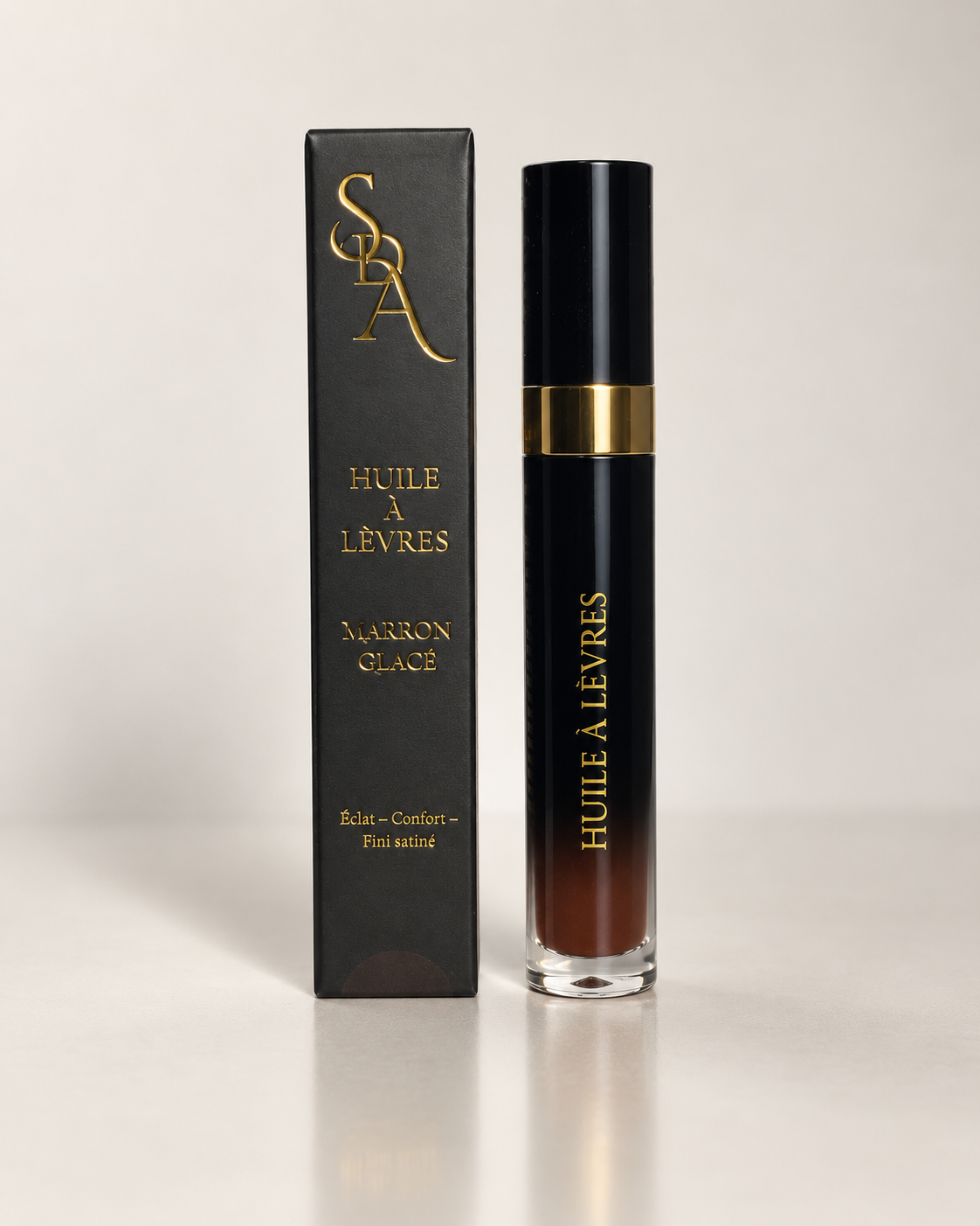 Huile à lèvres Secrets d'Autrefois teinte Marron Glacé, flacon noir et or avec son étui